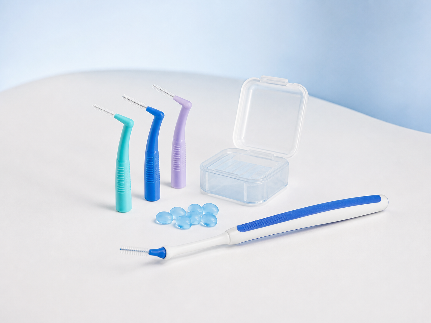 An assortment of interdental brushes and orthodontic comfort-care accessories.
